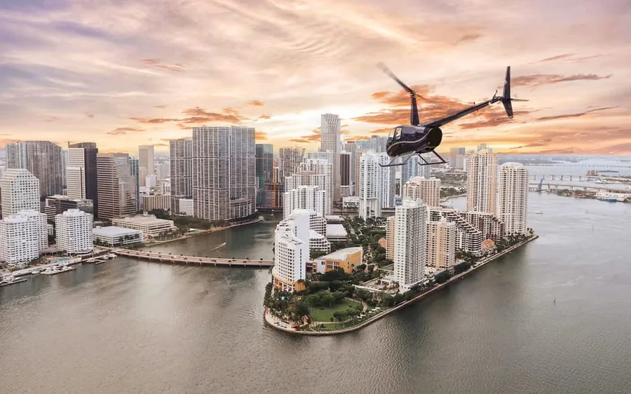 A helicopter lifting off from Pembroke Pines toward Miami
