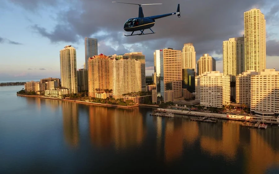 A helicopter over Fisher Island and the Miami skyline