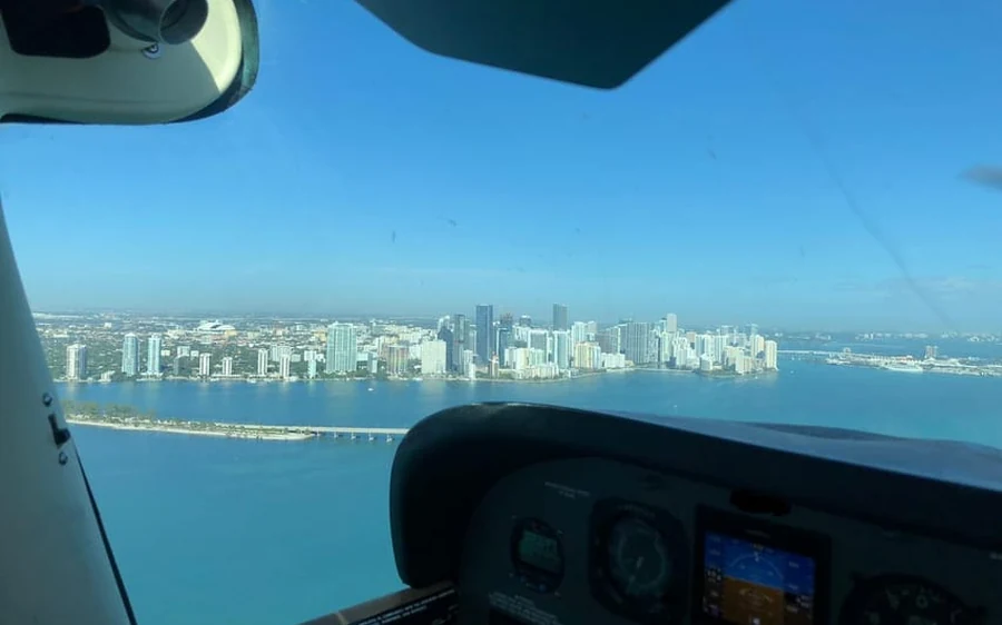 A small plane over the Miami coastline