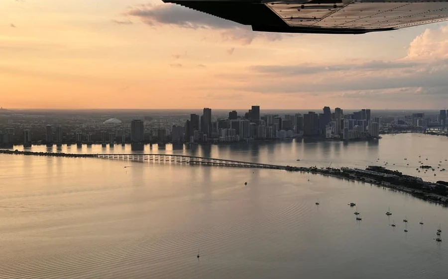 A small plane over Downtown Miami and Coral Gables
