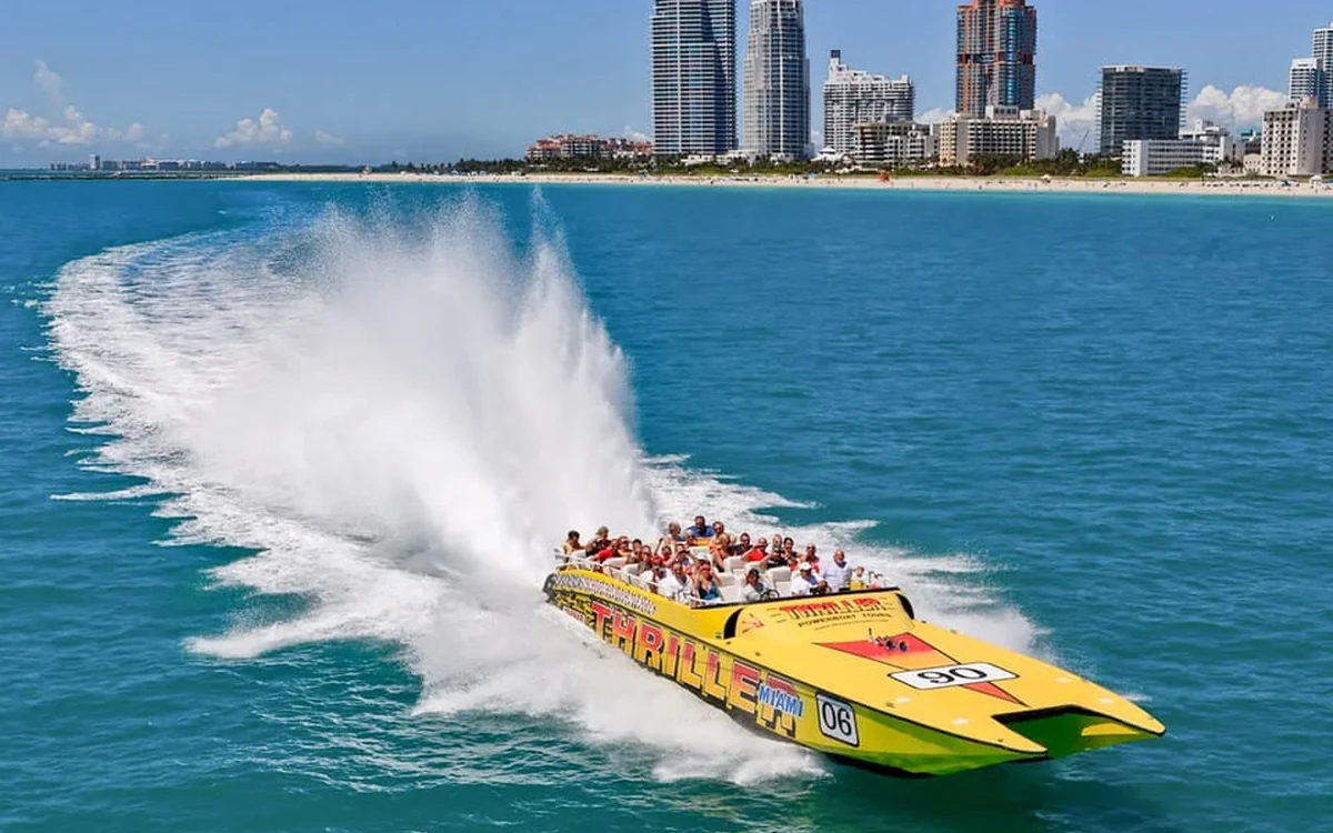 A speedboat cutting a wake across Biscayne Bay